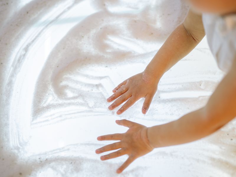 Child exploring sensory foam play